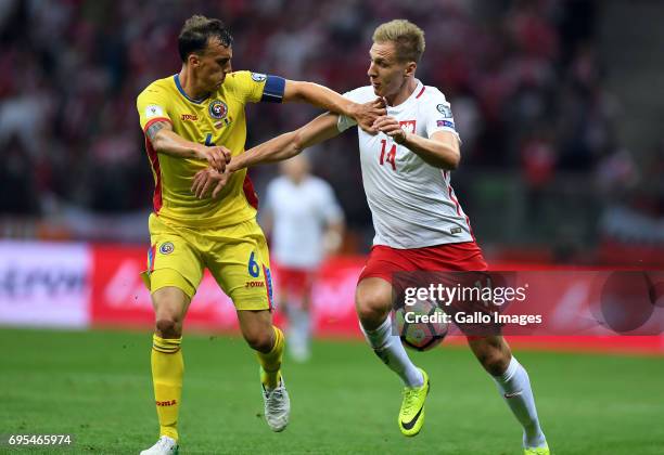 Vlad Chiriches of Romania and Lukasz Teodorczyk of Poland in action during the 2018 FIFA World Cup Russia eliminations match between Poland and...