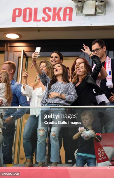 Marina Luczenki of Wojciech Szczesny of Poland, Anna Lewandowska of Valeri Kazaishvili of Legia Warszawa takes a selfie during the 2018 FIFA World...