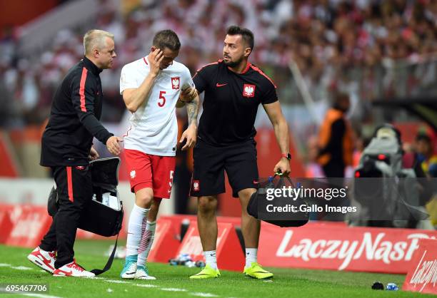 Krzysztof Maczynski of Poland injuried during the 2018 FIFA World Cup Russia eliminations match between Poland and Romania on June 10, 2017 at the...