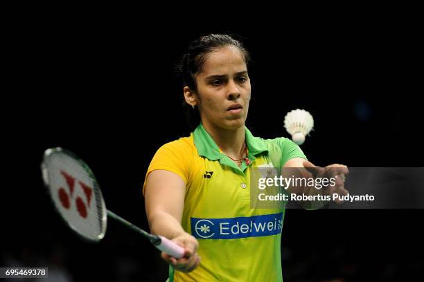 Saina Nehwal of India competes against Ratchanok Intanon of Thailand during Womens Single Round 1 match of the BCA Indonesia Open 2017 at Plenary...