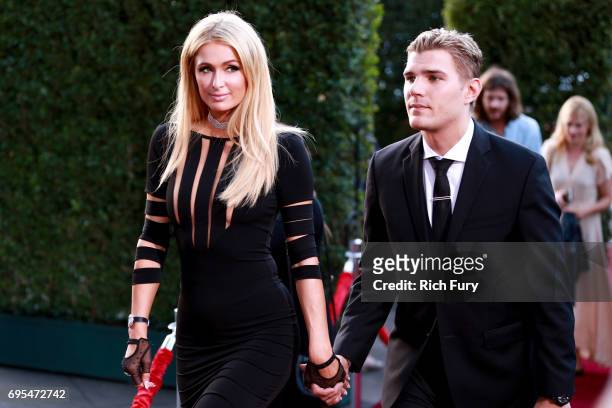 Paris Hilton and Chris Zylka attend the premiere of Focus Features' "The Beguiled" at Directors Guild Of America on June 12, 2017 in Los Angeles,...