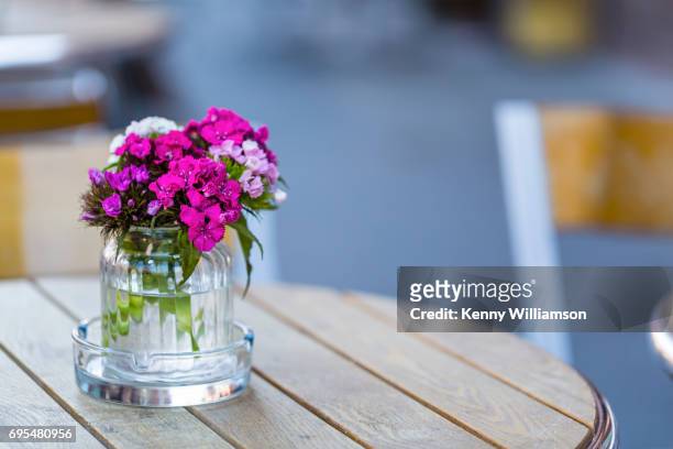 a small jar of flowers - askfat bildbanksfoton och bilder