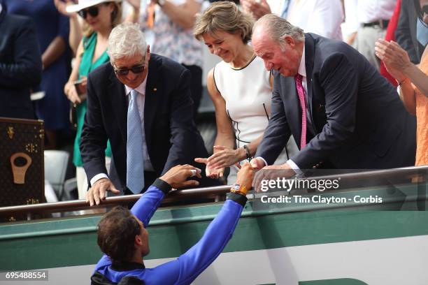 French Open Tennis Tournament - Day Fifteen. Rafael Nadal of Spain is congratulated by Juan Carlos of Spain after defeating Stan Wawrinka of...