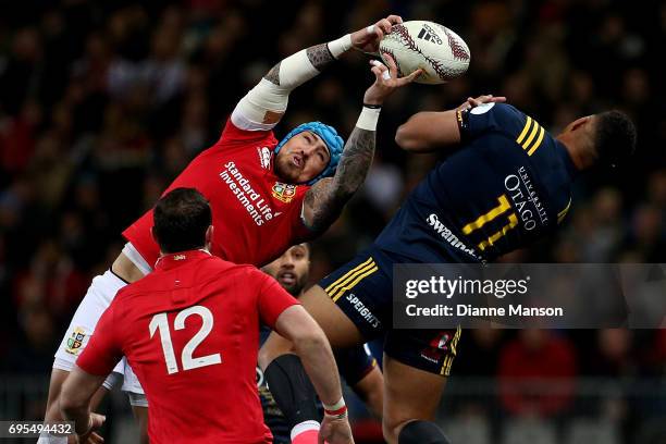 Jack Nowall of the Lions and Tevita Li of the Highlanders compete for a high ball during the match between the Highlanders and the British & Irish...