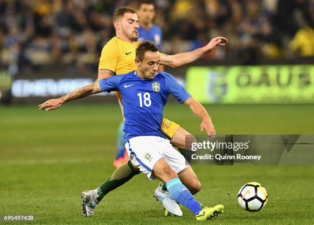 James Troisi of Australia and Marcio Rafael Souza of Brazil compete for the ball during the Brazil Global Tour match between Australian Socceroos and...