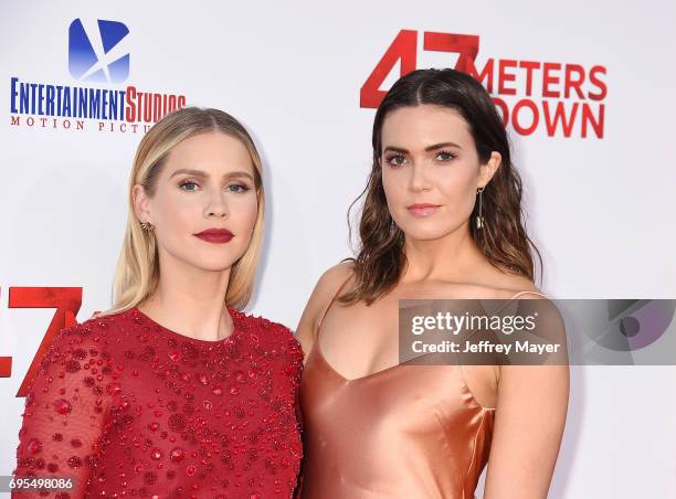 Actress Claire Holt and actress-singer Mandy Moore attend the Premiere Of Dimension Films' '47 Meters Down' at Regency Village Theatre on June 12,...