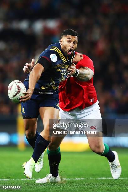 Lima Sopoaga of the Highlanders offloads the ball during the match between the Highlanders and the British & Irish Lions at Forsyth Barr Stadium on...