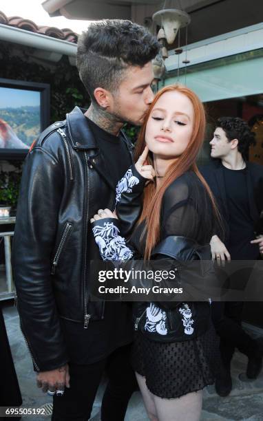 Travis Mills and Madelaine Petsch attends the Popular X Wildfox Cover Launch Event For Madelaine Petsch in Los Angeles on June 12, 2017 in Los...