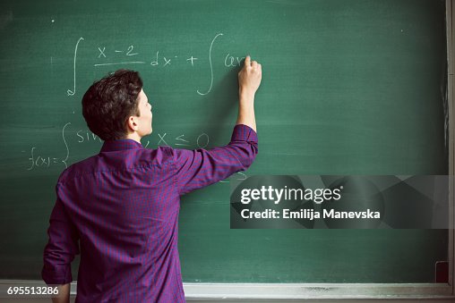 Student Solvnga Math Problem Student Solving Math Problems High-Res Stock Photo - Getty Images