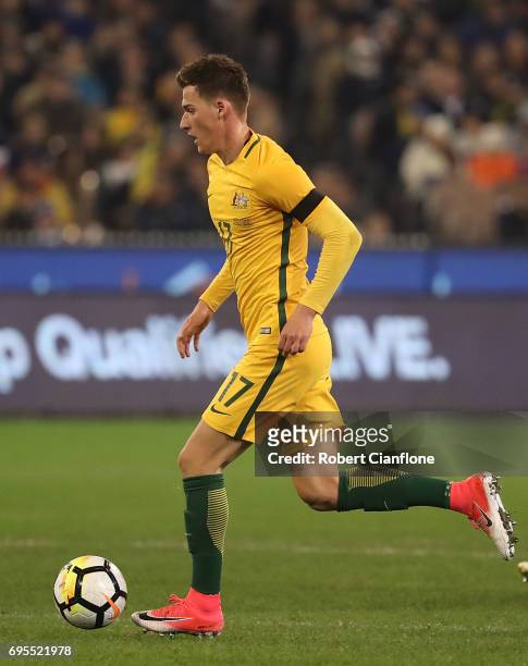 Ajdin Hrustic of Australia runs with the ball during the Brasil Global Tour match between Australian Socceroos and Brazil at Melbourne Cricket Ground...