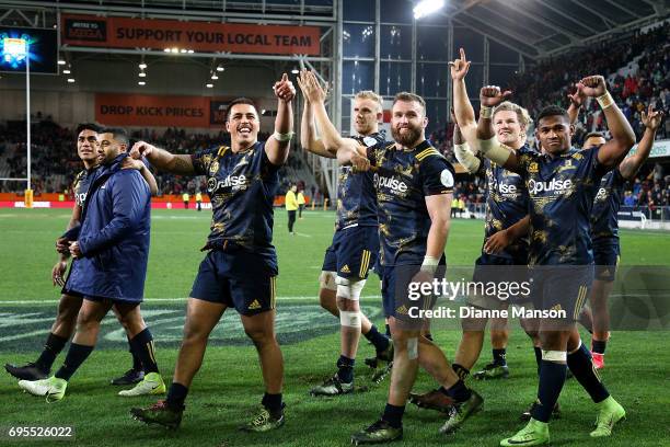 Highlanders players celebrate after the match between the Highlanders and the British & Irish Lions at Forsyth Barr Stadium on June 13, 2017 in...