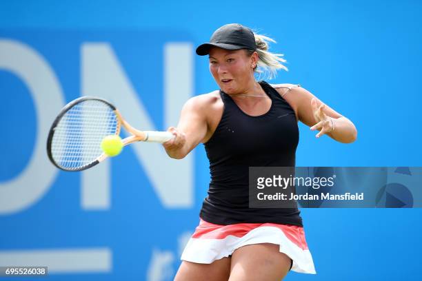 Tara Moore of Great Britain plays a forehand during her Women's first round singles match against Johanna Konta of Great Britain on day two of the...