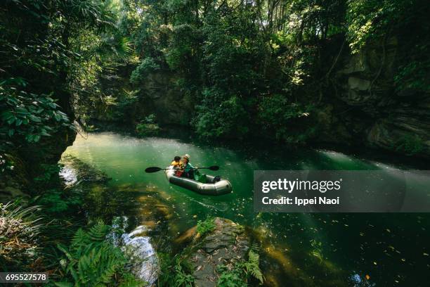mother and child paddling a packraft together in beautiful river gorge, japan - saitama prefecture ストックフォトと画像