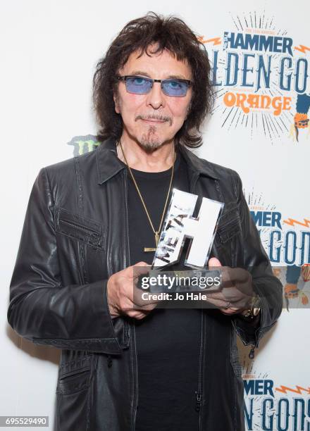 Tony Iommi is presented with the Golden God Award for Black Sabbath at the Metal Hammer Golden God Awards at the O2 Indigo on June 12, 2017 in...