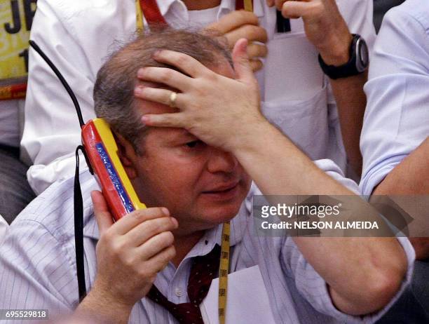 Brazilian trader looks upset as he negotiates during the afternoon session at the Mercantile & Futures Exchange , in Sao Paulo, Brazil, on September...