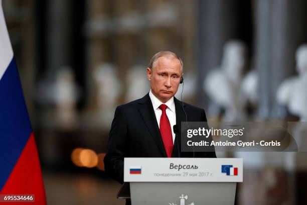 Russian President Vladimir Putin during a joint press with French President Emmanuel Macron at 'Chateau de Versailles' on May 29, 2017 in Versailles,...