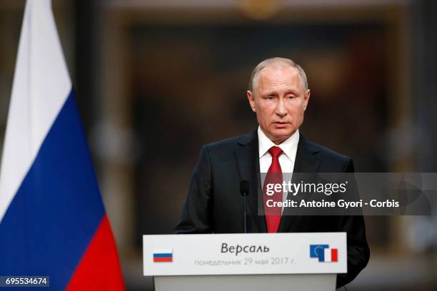 Russian President Vladimir Putin during a joint press with French President Emmanuel Macron at 'Chateau de Versailles' on May 29, 2017 in Versailles,...