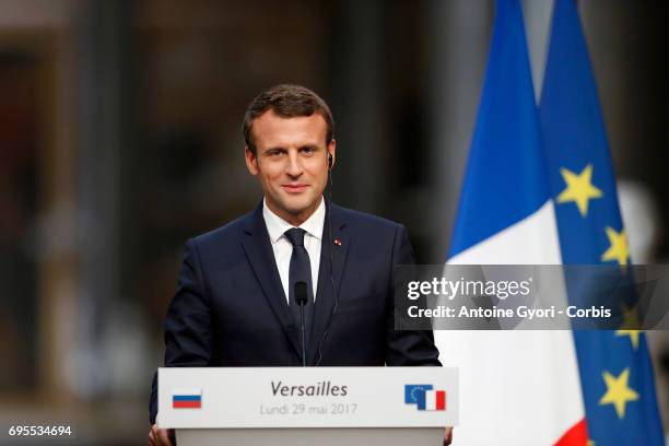 French President Emmanuel Macron during a joint press with Russian President Vladimir Putin at 'Chateau de Versailles' on May 29, 2017 in Versailles,...