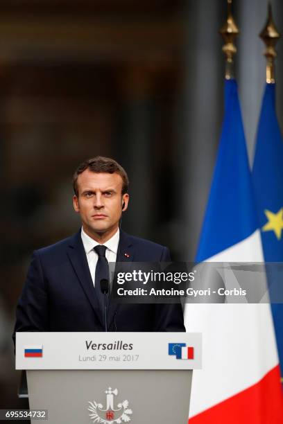 French President Emmanuel Macron during a joint press with Russian President Vladimir Putin at 'Chateau de Versailles' on May 29, 2017 in Versailles,...