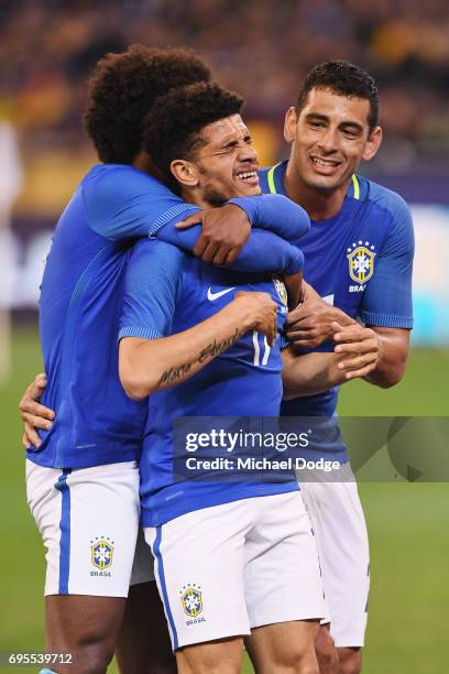 Taison Freda of Brazil celebrates a goal during the Brasil Global Tour match between Australian Socceroos and Brazil at Melbourne Cricket Ground on...