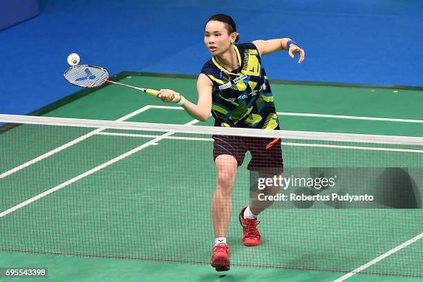 Tai Tzu Ying of Chinese Taipei competes against Minatsu Mitani of Japan during Womens Single Round 1 match of the BCA Indonesia Open 2017 at Plenary...