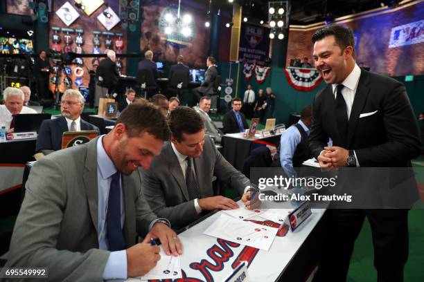 Nick Swisher jokes with Jeff Francoeur and Kelly Johnson prior to the 2017 Major League Baseball Draft at Studio 42 at the MLB Network on Monday,...