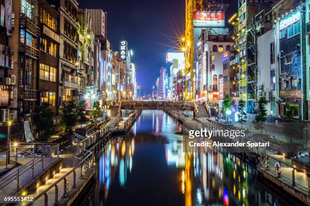 dotonbori canal at night, osaka, japan - osaka prefecture stock pictures, royalty-free photos & images