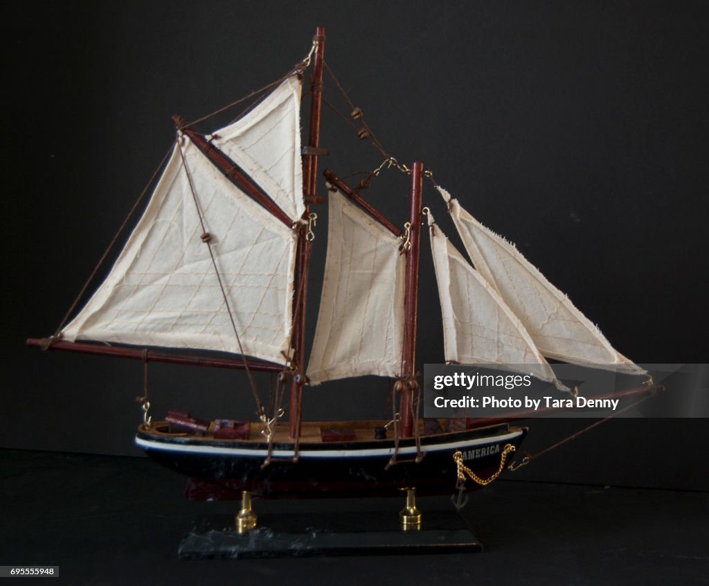Model Ship against black background stock images