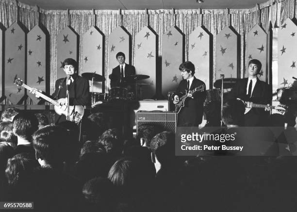View from the back of the hall looking over the top of the audience as The Beatles perform at the Majestic Ballroom, Finsbury Park, London, 24th...
