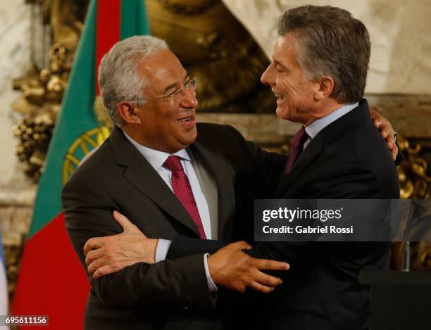 Prime Minister of Portugal Antonio Costa and President of Argentina Mauricio Macri embrace during a press conference as part of an official visit of...