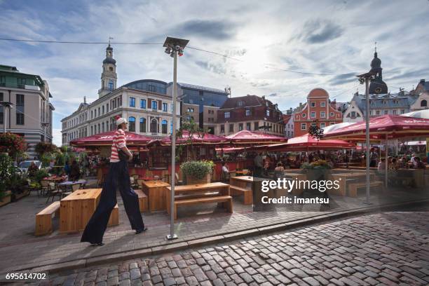 clown in livu square - livu square stock pictures, royalty-free photos & images