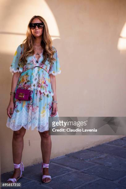 Elisa Taviti wears a Blumarine dress and a Furla bag during Pitti Immagine Uomo 92. At Fortezza Da Basso on June 13, 2017 in Florence, Italy.