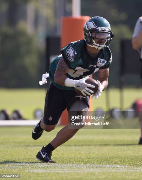 Donnel Pumphrey of the Philadelphia Eagles runs with the ball during mandatory minicamp at the NovaCare Complex on June 13, 2017 in Philadelphia,...