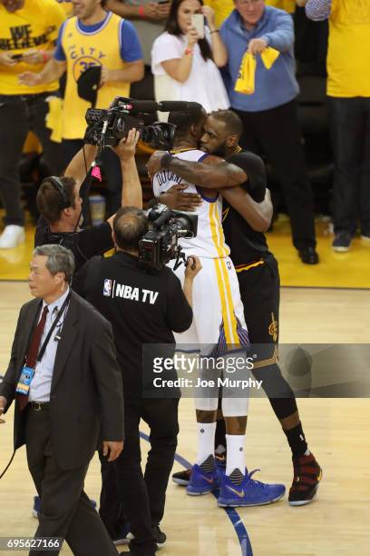 Kevin Durant of the Golden State Warriors and LeBron James of the Cleveland Cavaliers hug after Game Five of the 2017 NBA Finals on June 12, 2017 at...