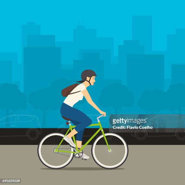 young woman riding her bike with a big city and cars on the background stock illustration - summer stock illustrations ストックフォトと画像