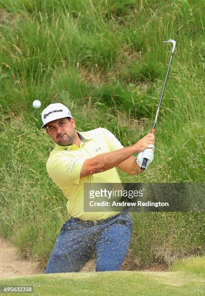Roberto Diaz of Mexico plays his shot on the 16th hole during a practice round prior to the 2017 U.S. Open at Erin Hills on June 13, 2017 in...