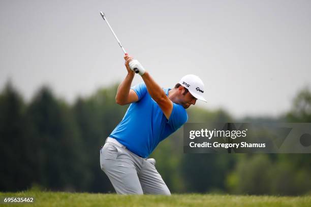 Jon Rahm of Spain plays a shot on the first hole during a practice round prior to the 2017 U.S. Open at Erin Hills on June 13, 2017 in Hartford,...