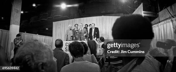 Commissioner Larry O'Brien presents the Seattle Supersonics with the trophy following Game Five of the 1979 NBA FInals at the Capital Center in...