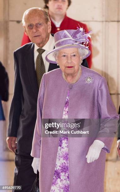 Queen Elizabeth II and Prince Philip, Duke of Edinburgh leave after attending Evensong in celebration of the centenary of the Order of the Companions...