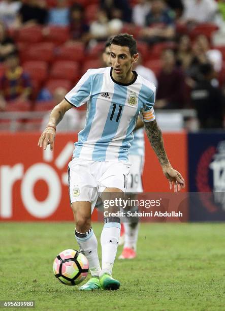 Angel Di Maria of Argentina looks to pass during the International Test match between Argentina and Singapore at National Stadium on June 13, 2017 in...