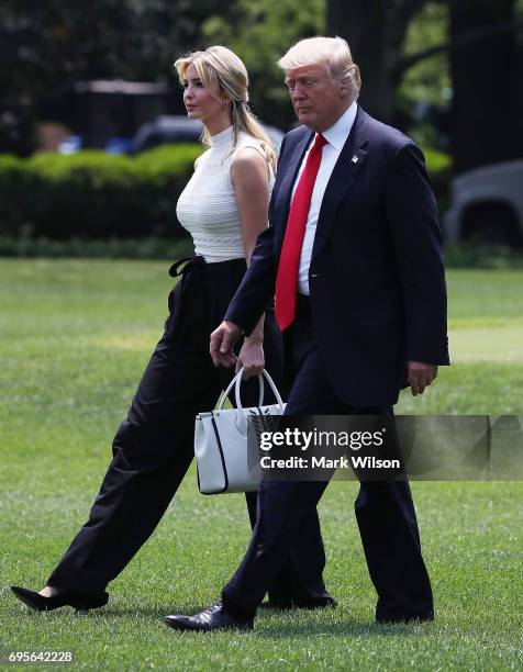 President Donald Trump and daughter Ivanka Trump walk toward Marine One before departing from the White House on June 13, 2017 in Washington, DC....