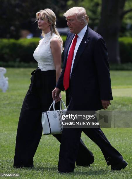 President Donald Trump and daughter Ivanka Trump walk toward Marine One before departing from the White House on June 13, 2017 in Washington, DC....