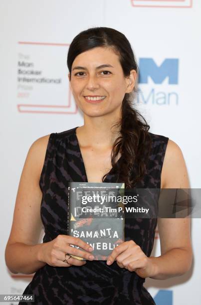 Author Samanta Schweblin of Argentina with the book 'Fever Dream' at a photocall for the shortlisted authors and translators for the Man Booker...