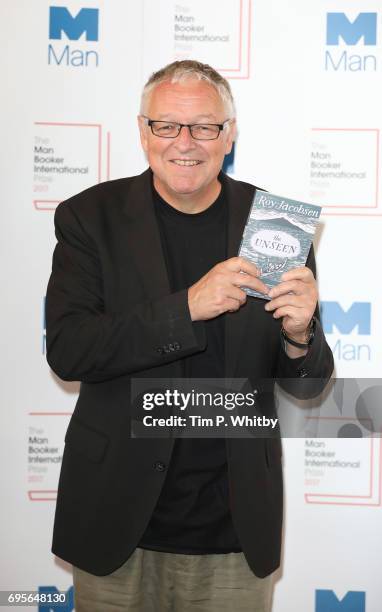 Author Roy Jacobsen of Norway with the book 'The Unseen' at a photocall for the shortlisted authors and translators for the Man Booker International...