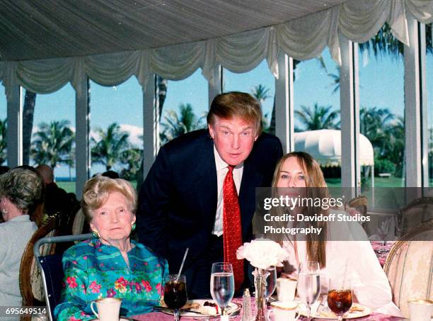 Portrait of, from left, American socialite Mary Trump, her son, real estate developer Donald Trump, and his girlfriend , former model Melania Knauss,...