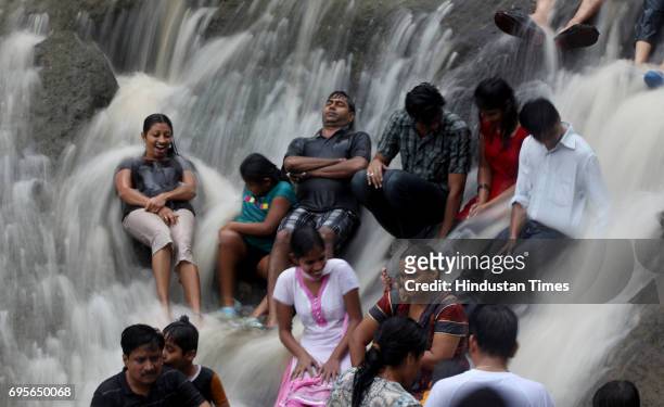 People having a gala time under water falls at Kanheri Caves on Sunday Morning.