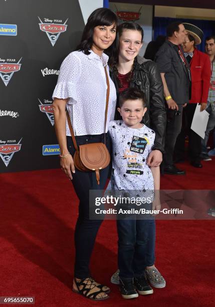 Actress Catherine Bell, daughter Gemma Beason and son Ronan Beason arrive at the premiere of 'Cars 3' at Anaheim Convention Center on June 10, 2017...