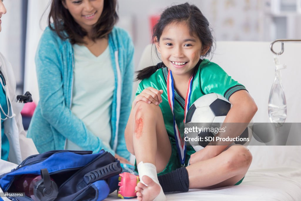 Young soccer champion with injuries