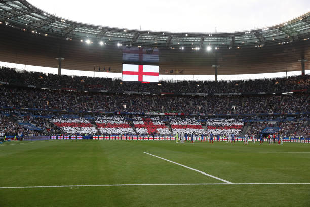 French fans display a St. George's cross prior to the international Friendly match between France and England at Stade de France, on June 13, 2017 in...
