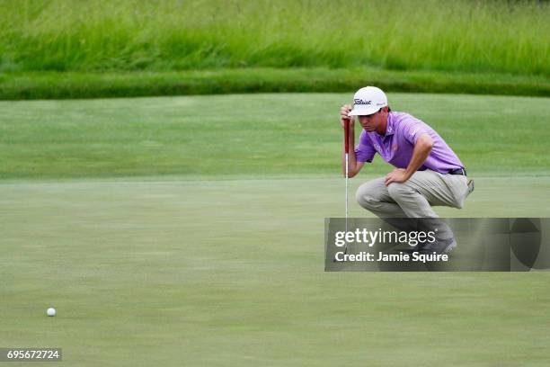 Poston of the United States lines up a putt during a practice round prior to the 2017 U.S. Open at Erin Hills on June 13, 2017 in Hartford, Wisconsin.